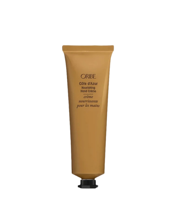 Золотистый тюбик крема для рук Oribe Cote d'Azur